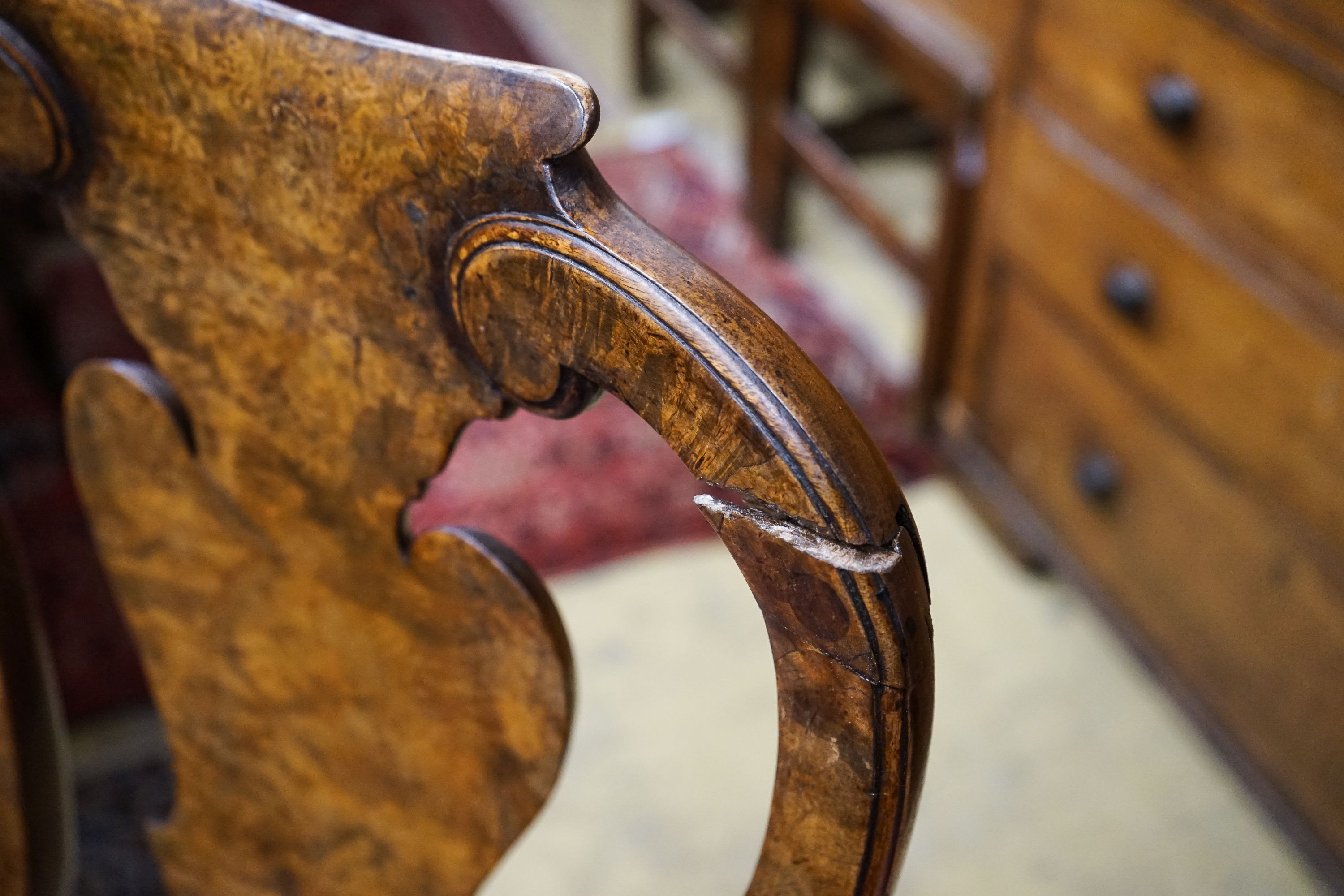 A set of four Queen Anne revival walnut dining chairs